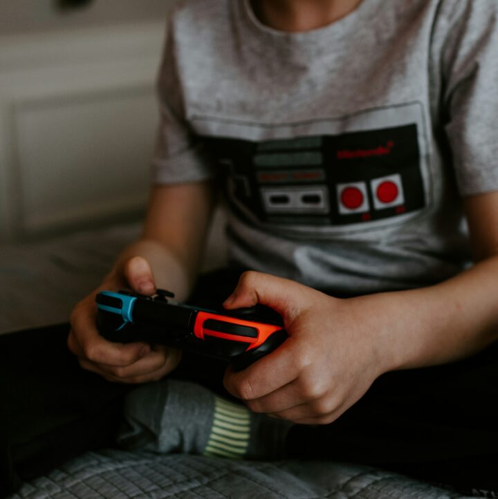 Boy playing video game during his hobby time